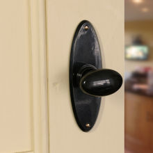 No. 6825 Black real Bakelite stepped door knobs with oval back plate. Also available in Mottled Brown